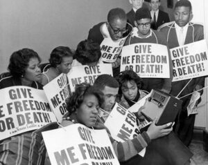 Who Taught You to Hate Us: “I do not care what he or she says. . . they would not like to be black here” –James Baldwin
